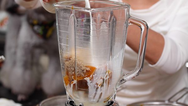 Place it into a blender. When it is still hot, add the sugar and half of the milk to the blender. Cover and blend the mixture, dissolving the sugar.