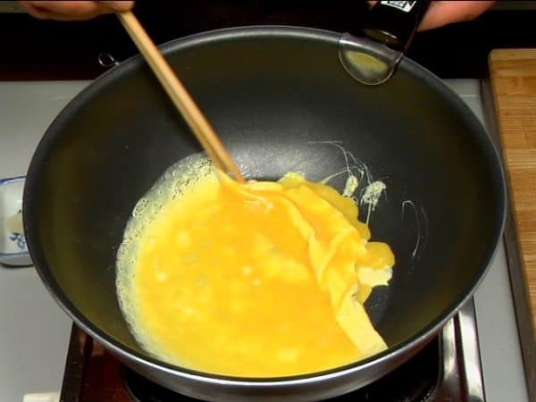 Spread the egg mixture on the surface. Start rolling the egg when it is half cooked.