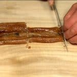 Chop the anago, conger eel into three pieces. Cut it into 1cm (0.4") pieces.