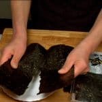 Finally, make a crease in the middle of the toasted nori seaweed and tear it into a quarter size sheets.