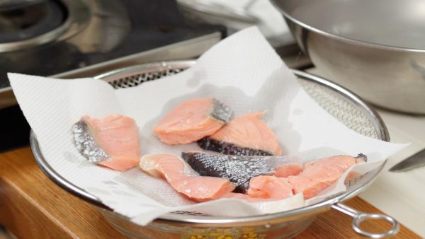 Place the pieces onto a mesh strainer covered with a paper towel. This process will remove any unwanted flavor.