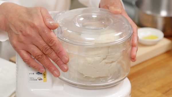 Cover and turn the processor to low speed. Then, gradually switch to high speed. Knead the dough for about 2 minutes until the surface is smooth and glossy. The kneading time slightly varies depending on the type of processor so adjust the time accordingly.