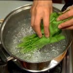 Cook the stems of the spinach and then the leaves.