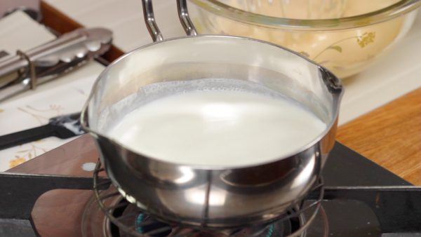 Heat the milk until small bubbles form around the edges of the pot.