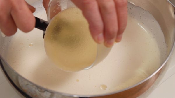 When it reaches about 80°C (176°F), remove the pot from the burner. Add the rehydrated gelatin and stir to dissolve completely.