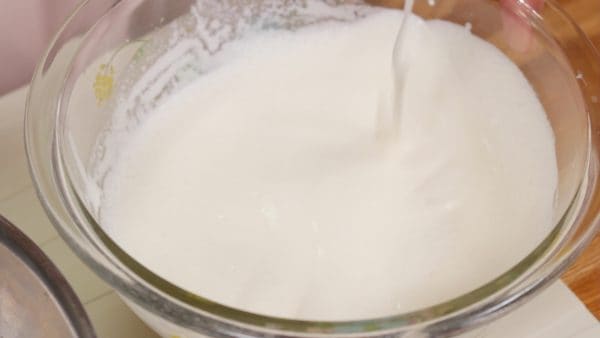 Whip the heavy cream to a thick and creamy stage with no peaks. If you lift the balloon whisk, the cream should streak down off it.