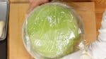 Place the cabbage in a bowl and cover it with 2 sheets of plastic wrap crosswise.