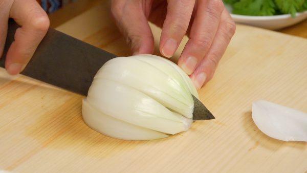Remove the root end of the onion. And slice it into 6 wedges.