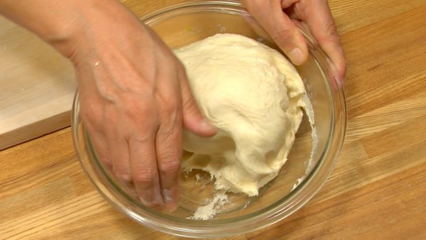 Remove the plastic wrap and knead the dough several times to let the air expel from the inside.