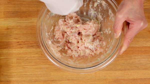 Loosely spread your fingers forming a rake shape, and mix the meat mixture until it turns gooey.