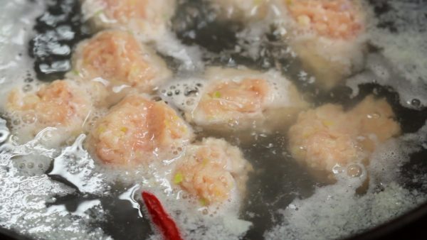 At first, the meatballs will sink to the bottom, but they should begin to float to the surface when cooked.