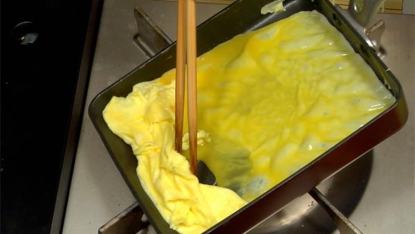 Quickly re-oil the pan, check the temperature, and pour into another one-third of the egg mixture. Spread the egg under the first layer of the omelet.