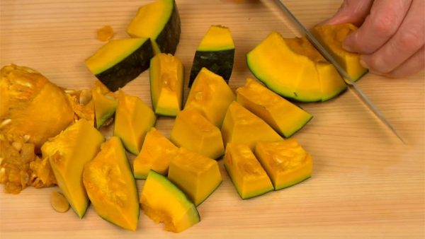 Remove the stem end and slice it into 1cm (0.4") pieces. The kabocha is hard so be careful not to cut yourself. You can also substitute any type of sweet squash.