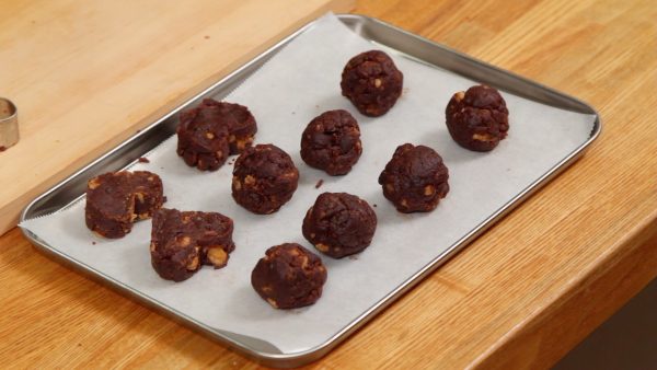 Then, shape the rest of the pieces into balls. Thoroughly chill the chocolate in the freezer or fridge.