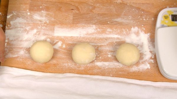 Line up all the dough balls on the pastry board dusted with flour.