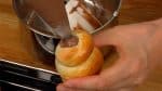 Insert the tip into the cornet hole and squeeze out the custard. Fill all the breads with the custard.