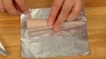 Wrap the paper cone with a sheet of square aluminum foil.