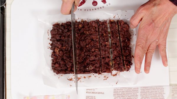 Now, the chocolate has firmed up. Cut the sheet of chocolate into 8 long rectangular pieces.