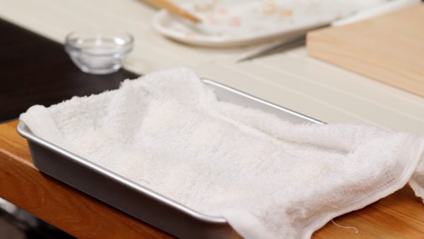 To keep it from drying out, cover the dough with a dampened towel and let it sit for about 30 minutes at room temperature.