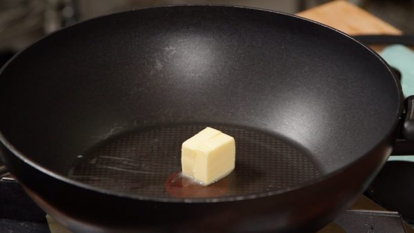 Now, clean the pan with a paper towel. Place the butter into the pan and turn the heat to low.