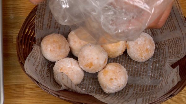 Place the donuts into a basket covered with wax paper.