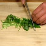 Cut the mitsuba parsley into 2cm (0.8") pieces.