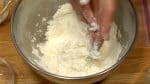 Toss to coat and moisten the flour evenly.