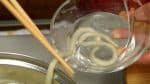 Pick a single string of udon noodle with chopsticks, immerse it in cold water and see if it has the texture you like.
