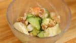 Spoon the avocado salad into a bowl. Finally, sprinkle on the walnuts.