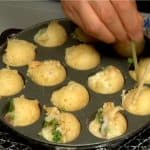 And then rotate the takoyaki 90 degrees, shaping them into balls.