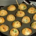 When the takoyaki turns smoothly with a slight flick of the bamboo tip, they are ready to serve.