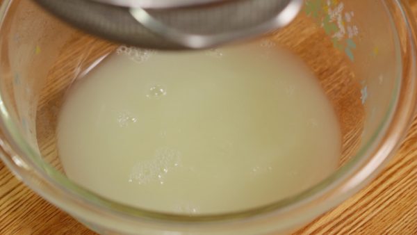 The liquid is called whey, a by-product of cheese making. It is full of nutrients so don't throw it away. You can use the whey when you make curry or stew to give it a rich flavor.