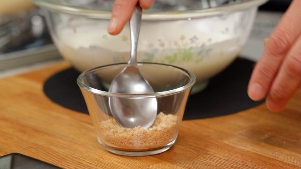 Cover the bottom of a clear cup with the crumbled cookie.