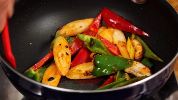 Turn the heat to medium and stir-fry the vegetables.
