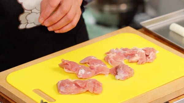 Slice the chicken into bite-size pieces using diagonal cuts.