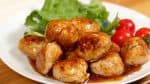 Place the meatballs onto a plate along with the cherry tomatoes and green leaf lettuce. Pour the remaining sauce over the top.