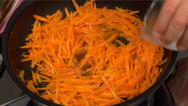 Adding a small amount of water will help the carrot cook quickly. Continue stirring until the carrot softens.