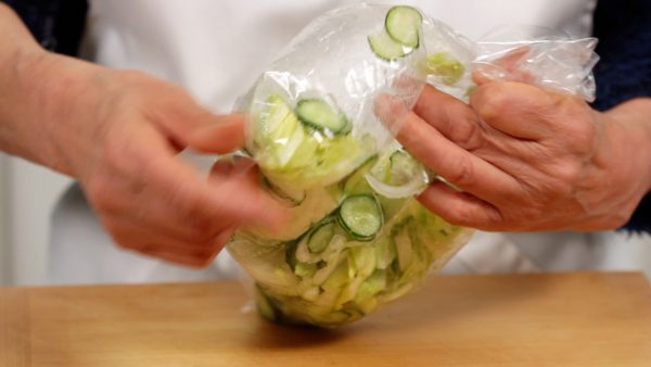 Close the bag but leave the air inside. Shake it to coat the vegetables with the salt. Adding a small amount of water will help to season the vegetables evenly.