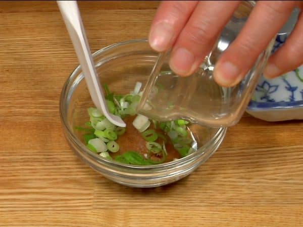 Add the negi, spring onion leaves to the miso. Dilute the miso a little with sake or water. Combine well, making a smooth negi miso paste.