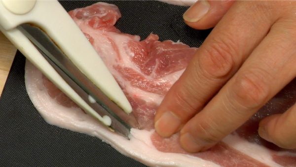 Make cuts in tough stringy parts between the lean meat and fat.