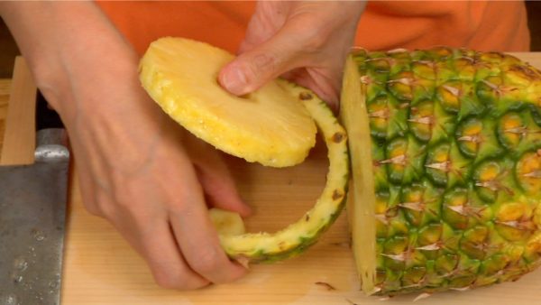 Cut a pineapple slice about 1.5 cm (0.6")  thick and remove the core and the skin.