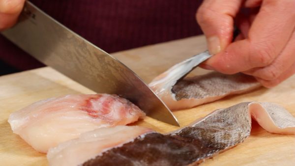 Now, press the fillet with the side of the knife and firmly pull the skin off with your hand.