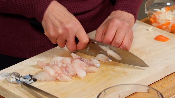 After removing the skins, chop the fillets into small pieces.