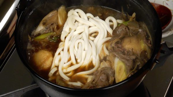 When you have finished most of the initial ingredients, you can add the udon noodles and spring onions to finish off the remaining broth.