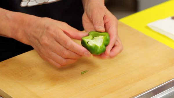 Cut the bell pepper in half lengthwise. Cut out the firm stem end and core. Lightly remove the seeds by hitting the pepper against the surface. No need to remove the seeds completely.