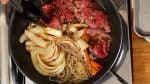 Now, loosen up the beef slices and place them into the broth.