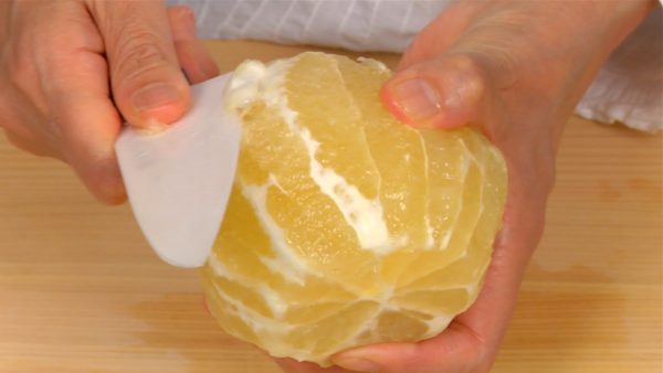 Slice off the remaining white pith.