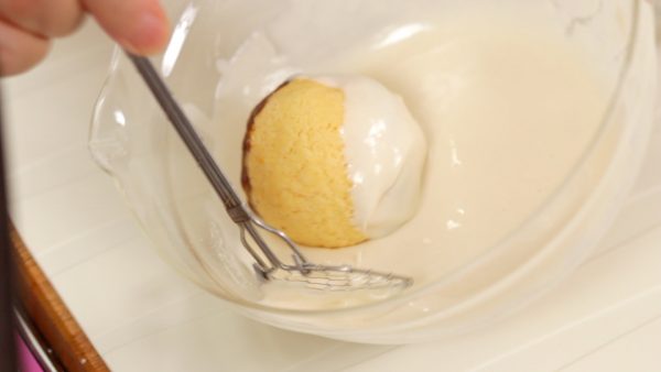 Now, remove one piece of the ice cream ball from the freezer and coat it with the batter.