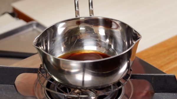 First, let’s make the special Worcestershire-based sauce. In a small pot, combine the Japanese Worcestershire sauce, tonkatsu sauce, mirin, sugar and water. Turn on the burner.