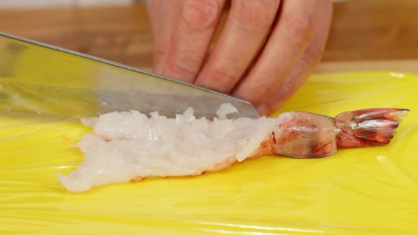 Now, make numerous shallow cuts along the prawn crosswise and also lengthwise.
